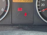 a close up of a car dashboard with a clock on it