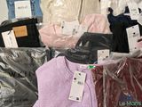 a pile of clothing that is sitting on a table