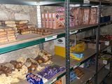 many shelves of food and snacks on the shelves