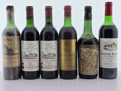 six bouteilles de vin sont alignées sur une table