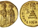 une pièce d'or portant l'image d'un homme et d'une femme