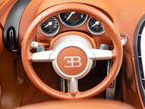 a close up of the steering wheel and dashboard of a bugatti
