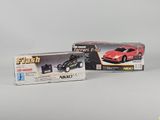 a toy car and a remote control car in a box