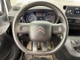 the interior of a car with a steering wheel and dashboard controls