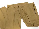 men ' s khaki pants on a white background