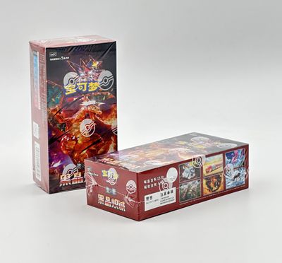 two boxes of card games are sitting side by side on a white surface