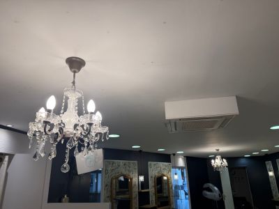a chandelier hanging from the ceiling in a room