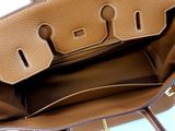 the inside of a purse with a handle and a strap
