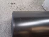 a close up of a metal cup on the ground