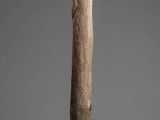 an image of a wooden stick with a bird on top of it