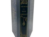 an old book with a black cover and gold writing on it