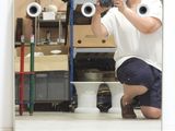a man that is taking a picture of himself in the mirror