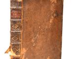 an old book that is sitting on top of a table