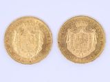 two gold sovereigns, one of which has a coat of arms and the other of which is a shield