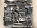a tool in a case that is sitting on the floor