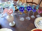 a table with a bunch of glasses and plates on it