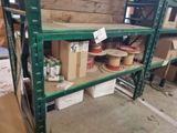 many boxes and cans of paint on the shelves