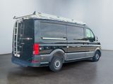an image of a black van parked in a room