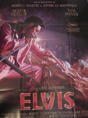 une image d'une affiche de film représentant Elvis avec une guitare