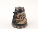 a black and white vase with a painting on it