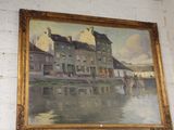 a painting on the wall of a building by the water