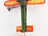 a toy airplane that is hanging on the wall