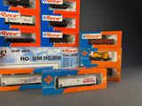 a lot of toy trains in boxes on a table