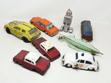 several toy cars are lined up in a circle on a white surface