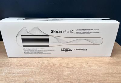 a white box with a black and silver toothbrush in it