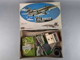 a box with a model of a fighter jet in it