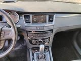 the interior of a car with a steering wheel and dashboard controls