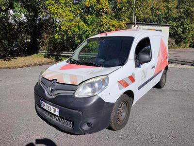 a white van with an orange stripe parked in a parking lot
