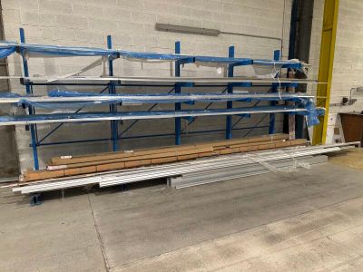a long shelf with several shelves on it in a warehouse