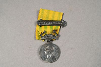 an image of a medal with a medal on top of it