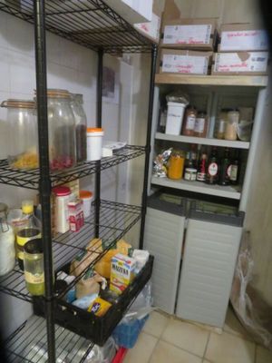 a pantry with a lot of food on the shelves