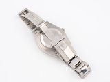 a close up of a wrist watch on a white surface