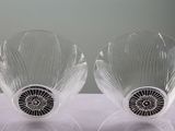 pair of clear glass vases with black and white designs on them