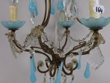 a small chandelier with three lights hanging from it
