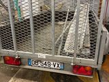 a truck that has a cage on the back of it