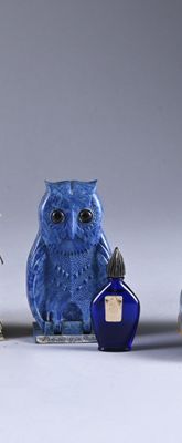 three blue and white owl figurines sitting next to each other