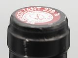 a close up of a bottle of wine with a label on it