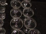 a lot of empty glasses sitting on a table