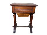 an old wooden table with a drawer on top of it
