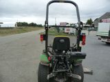 a tractor that is parked on the side of the road