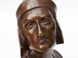 bronze statue of a woman wearing a headdress and a turban