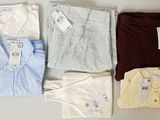 four men ' s shirts are laid out on a white surface
