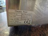 a label on the side of an electric fryer