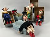 a group of clowns sitting in a box together