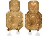 pair of gold plated wall sconces with hearts on them