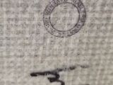 a close up of a piece of fabric with a stamp on it
